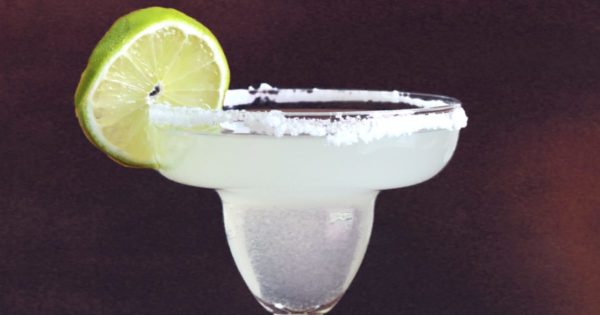 Closeup of classic margarita cocktail with lime