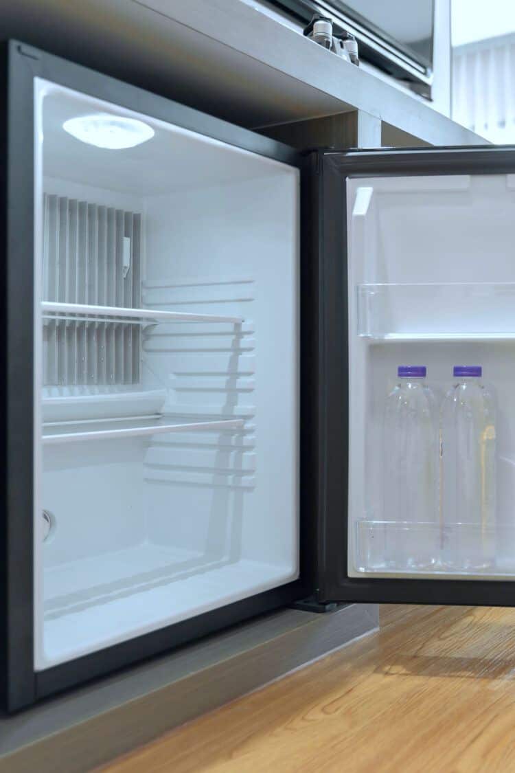 Open mini-fridge under desk