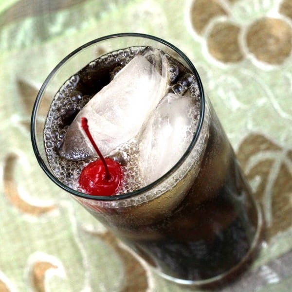 Tilted angle view of Mixy's Rum and Coke with cherry