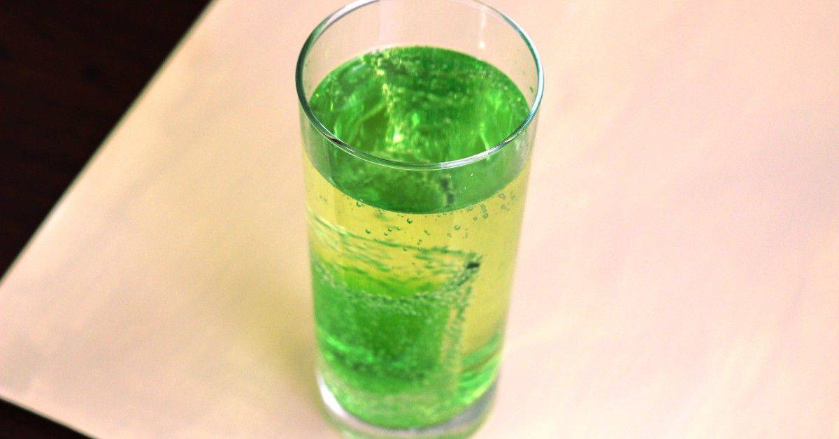 Mountain Dew drink with Midori shot inside