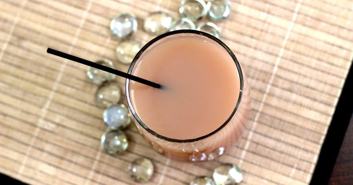 Overhead view of Nutcracker cocktail surrounded by glass pebbles