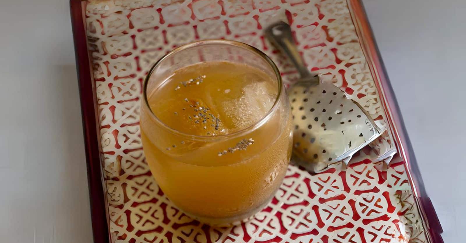 Opium Cocktail drink with poppy seeds floating on top