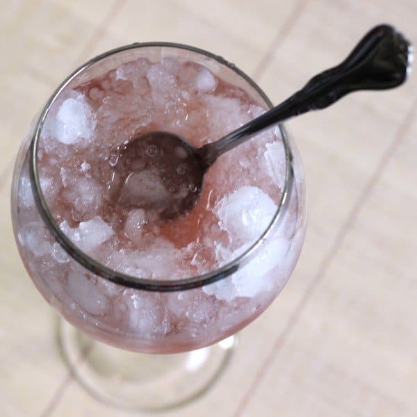 Overhead view of Pavlova Supreme drink with spoon