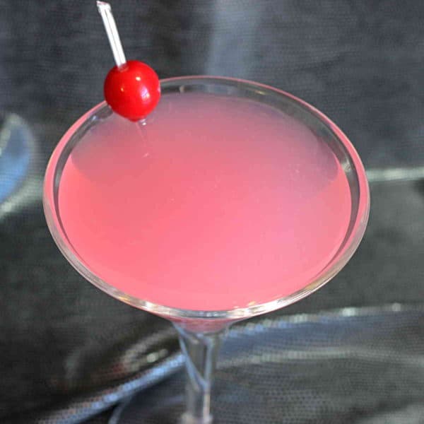 Overhead view of Pink Lady cocktail with cherry