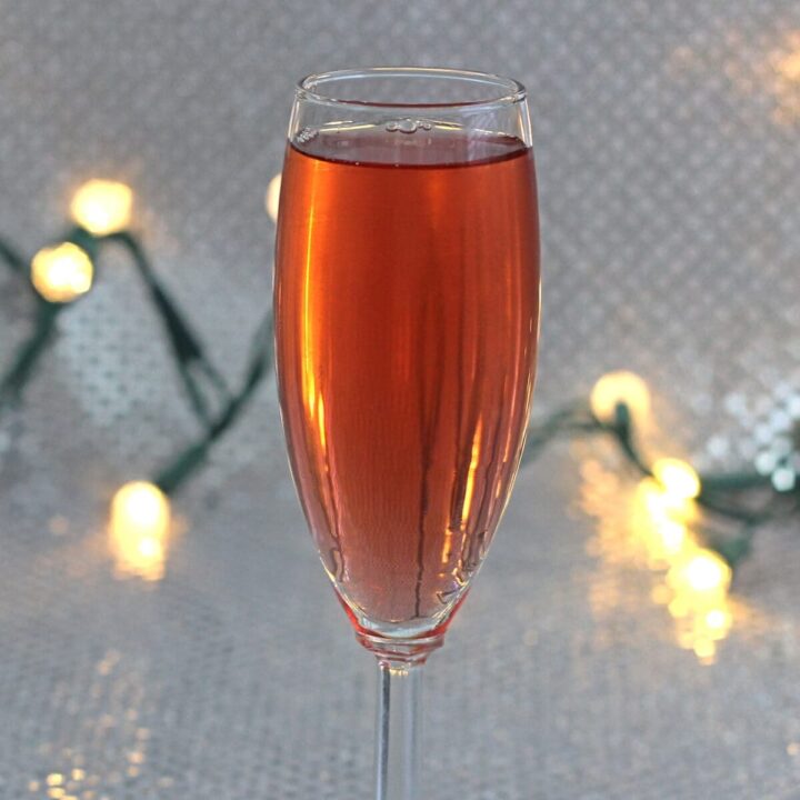 The Poinsettia is a champagne cocktail with orange and cranberry, which makes it ideal for holiday parties. It's light on the alcohol, easy to drink (even for very occasional drinkers) and festive.