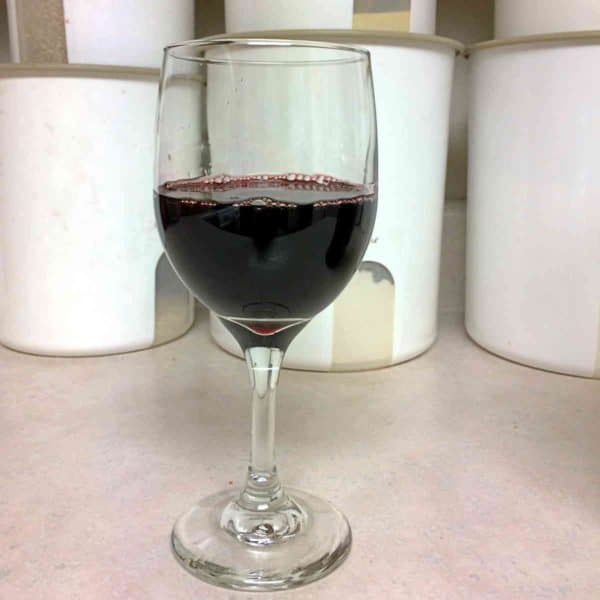 Glass of port on kitchen counter