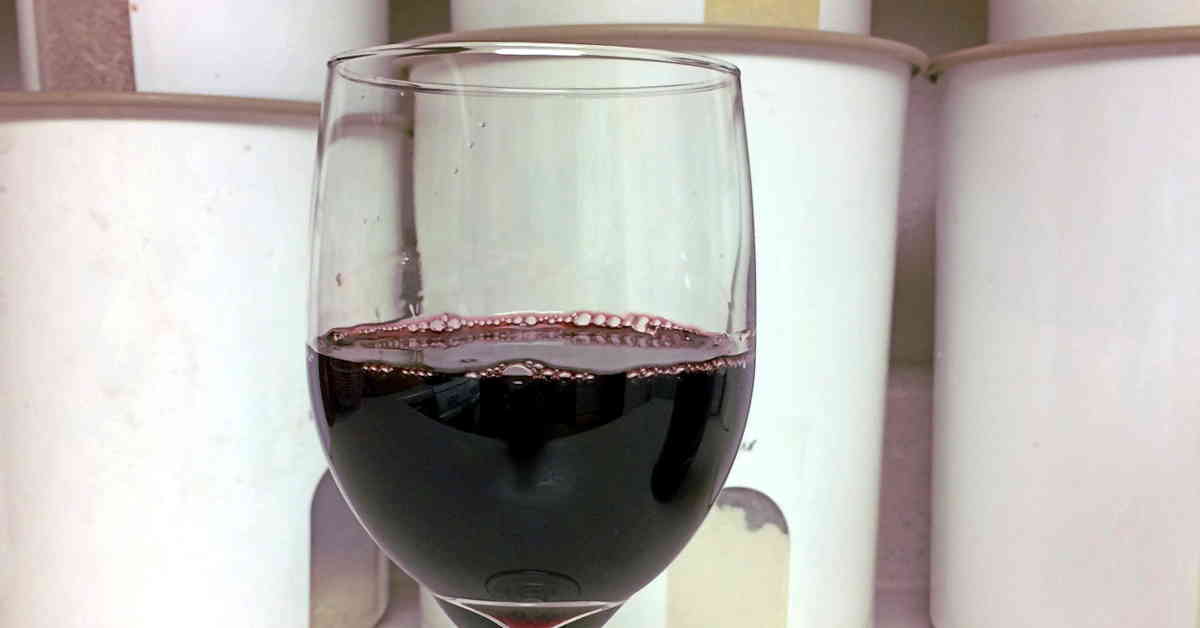 Glass of port on kitchen counter