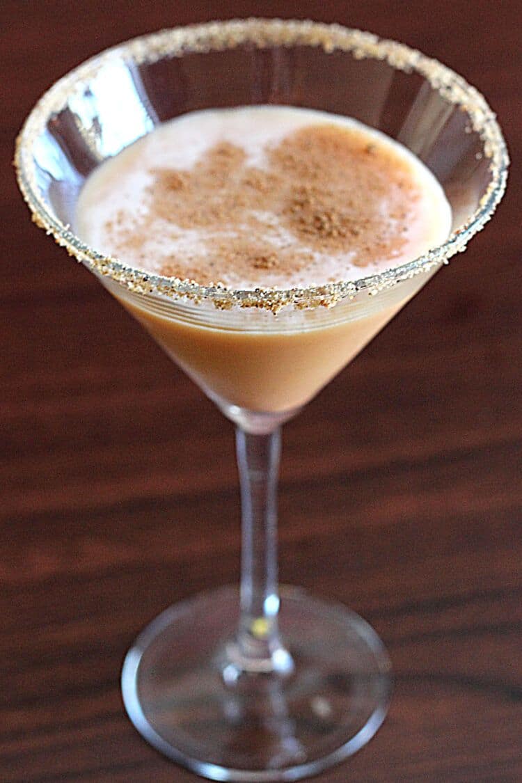 Closeup view of Pumpkin Pie Martini with graham cracker rim