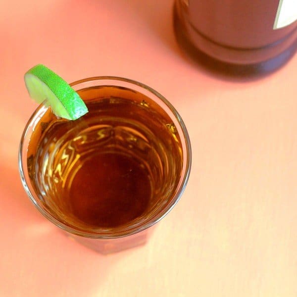 Overhead view of Queen Bee drink with lime garnish