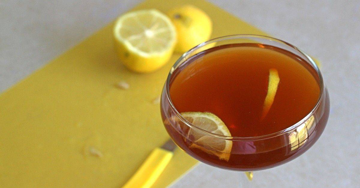 R.A.F. Cocktail with lemons on cutting board