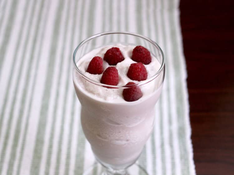 Raspberry White Chocolate Cheesecake drink with raspberries floating on top