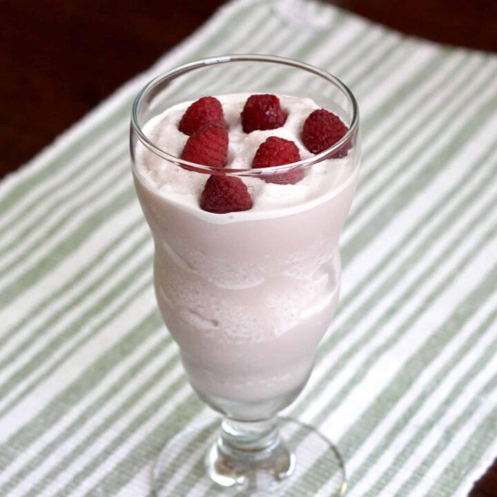 Raspberry White Chocolate Cheesecake drink with raspberries floating on top