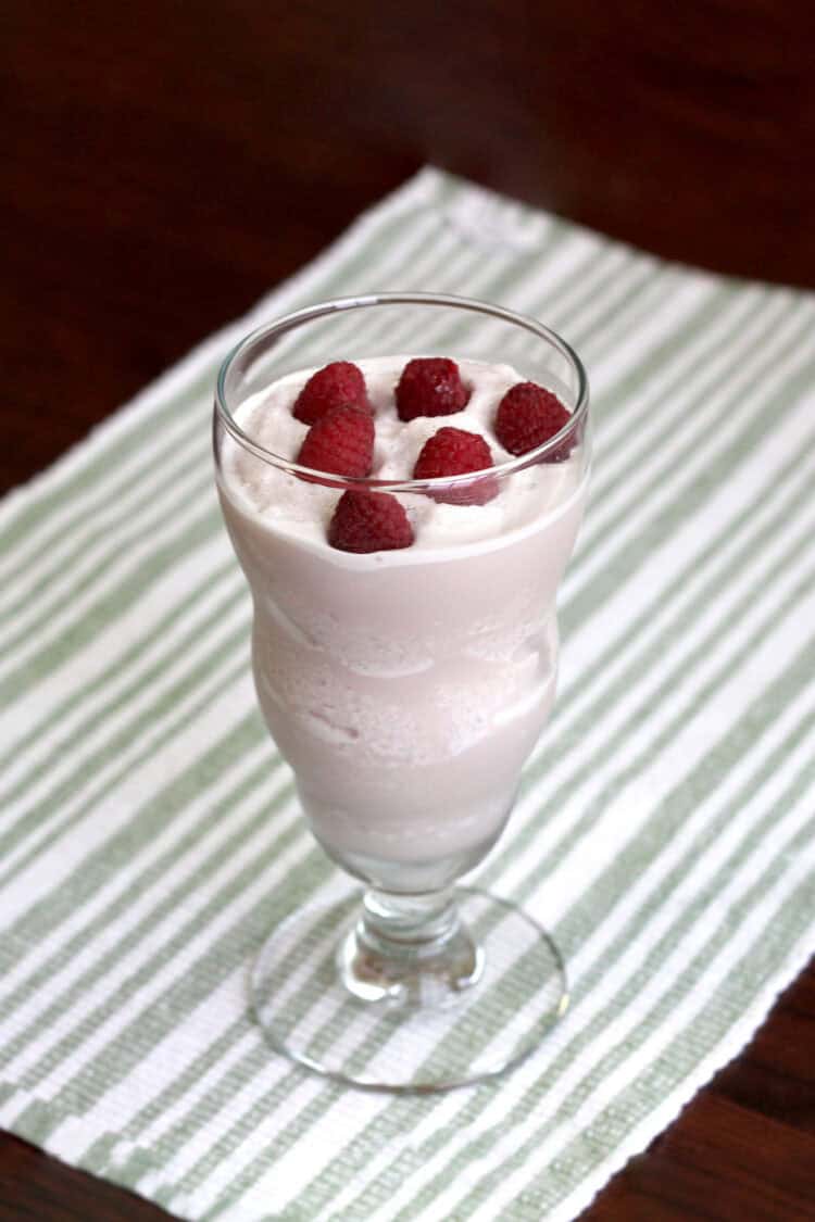 Raspberry White Chocolate Cheesecake drink with raspberries floating on top