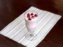 Raspberry White Chocolate Cheesecake drink with raspberries floating on top