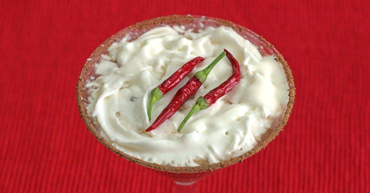 Red Hot Santa Tini with whipped cream and a chili powder cocoa rim