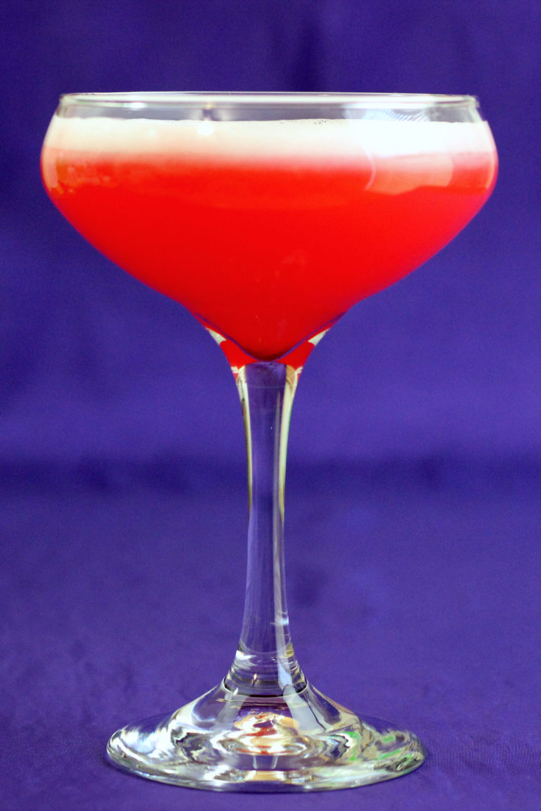 Full length view of Royal Clover Club Cocktail in champagne saucer