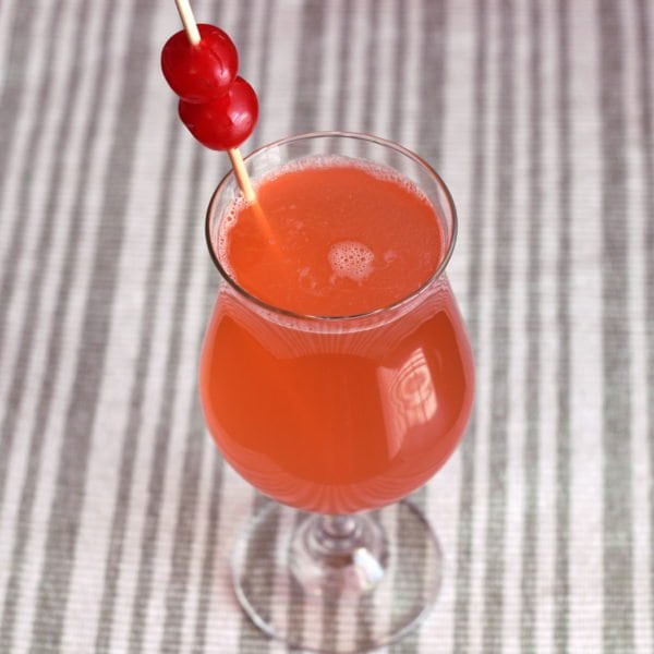 Ruby Red drink with cherries in parfait glass