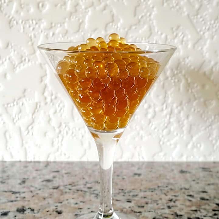 Rum caviar beads in martini glass