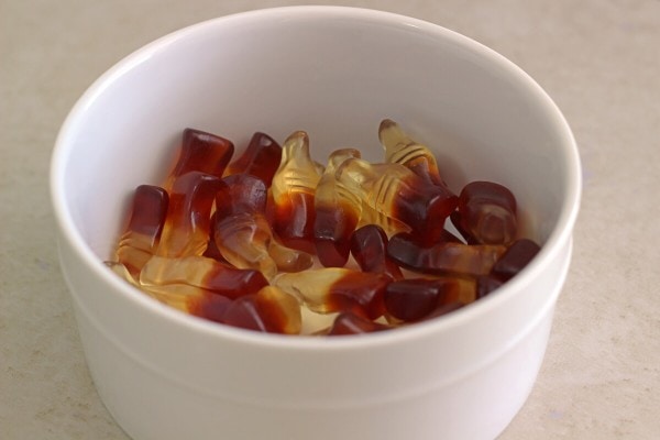 Cola gummies in white bowl