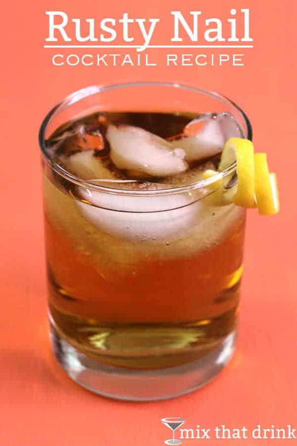 Rusty Nail cocktail with lemon twist