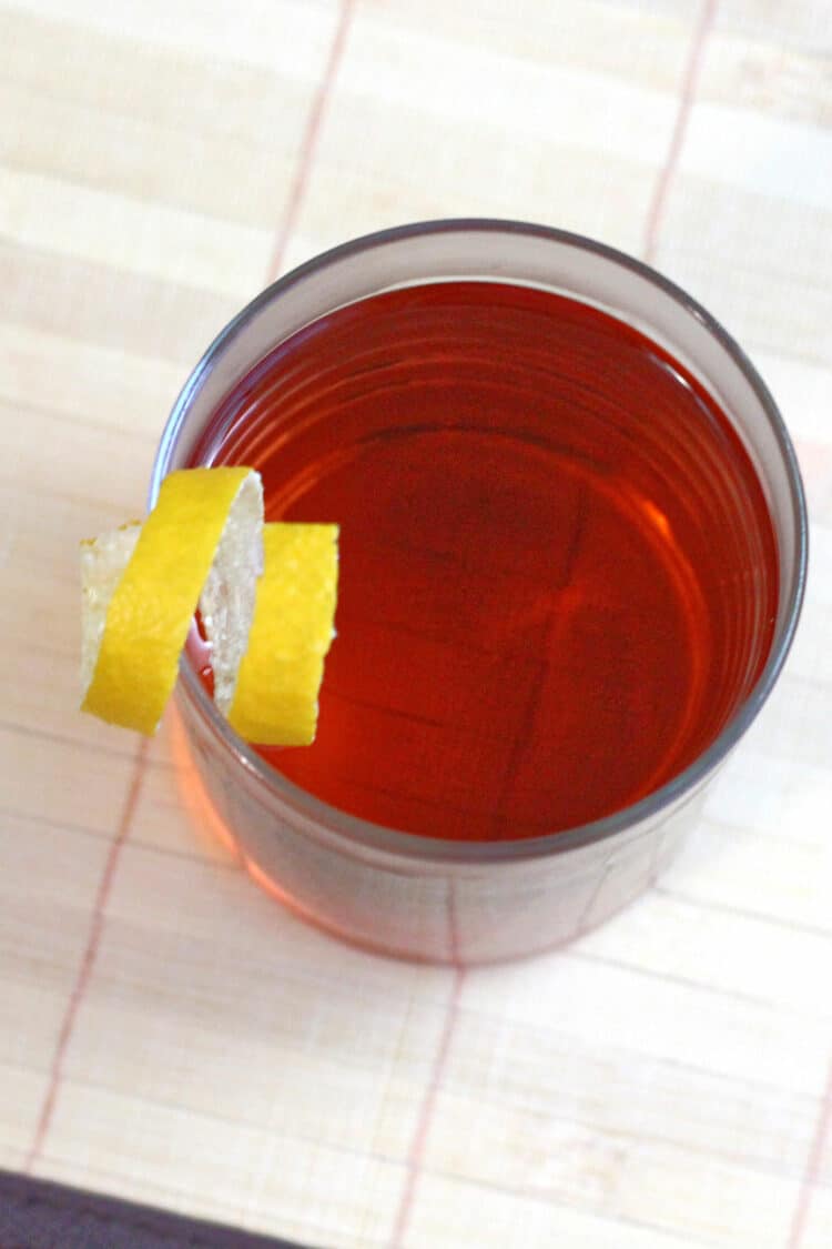 Overhead shot of Sazerac cocktail with lemon twist garnish