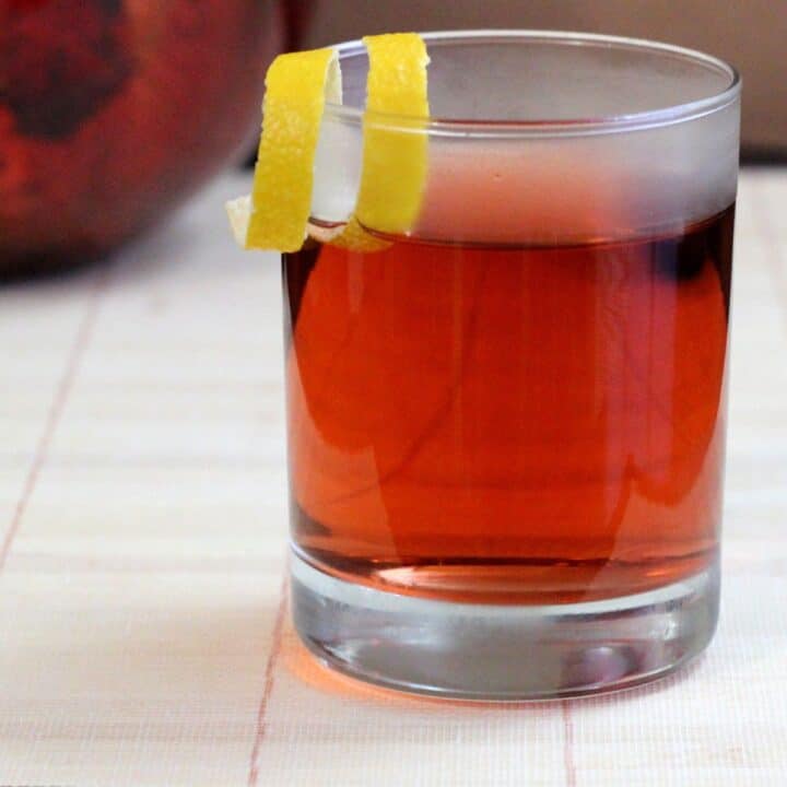 Sazerac cocktail with lemon twist