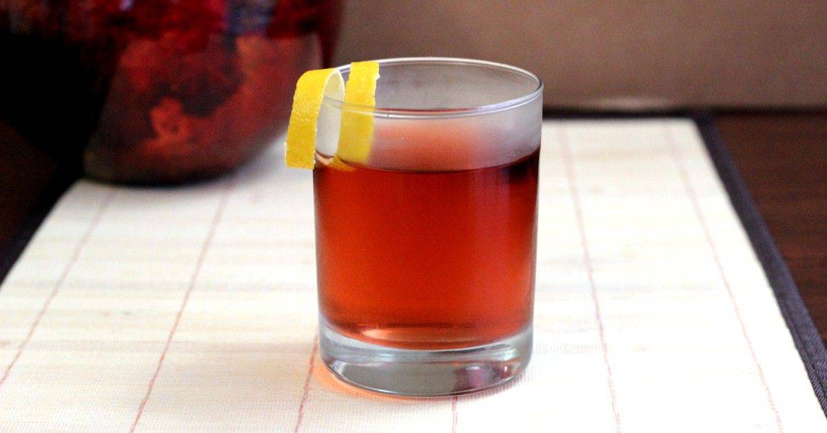 Sazerac cocktail with lemon twist