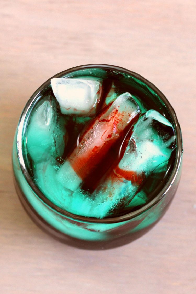 Overhead view of Shark Bite cocktail with grenadine floating like blood on top