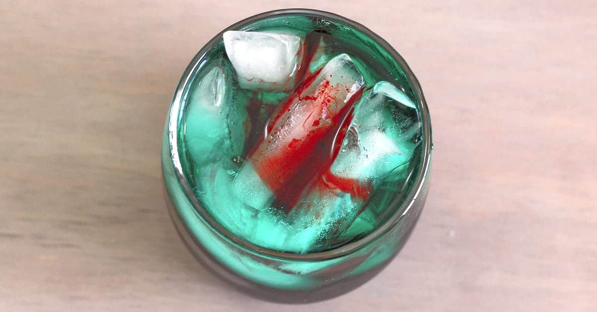 Overhead view of Shark Bite cocktail in rocks glass with ice