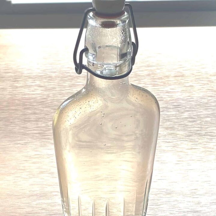 Bottle of simple syrup on table