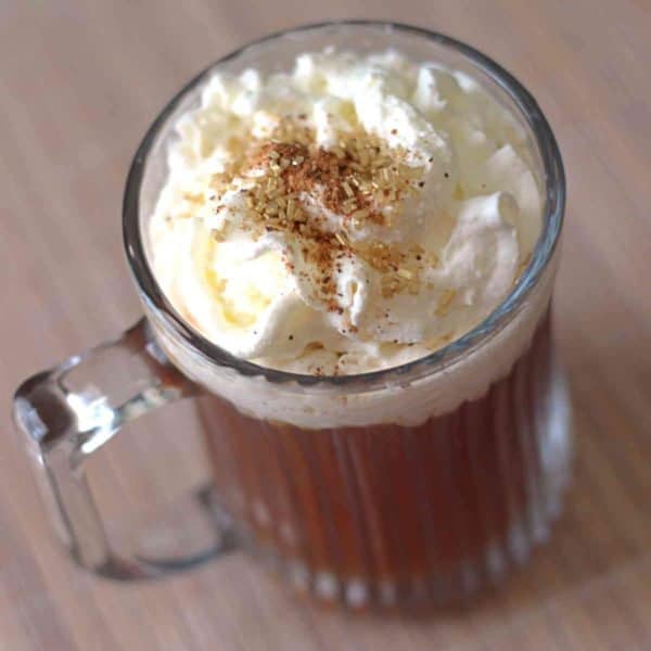 Tilted angle view of Spanish Coffee with whipped cream and cinnamon on top