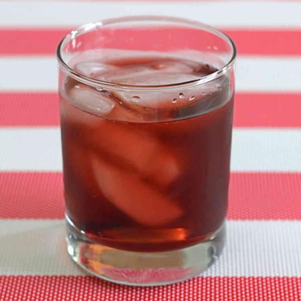 Closeup of Spiced Watermelon Cooler drink on red and white tablecloth