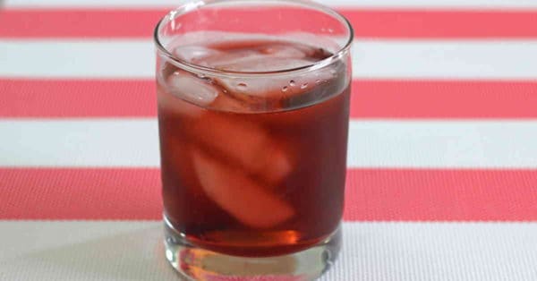 Spiced Watermelon Cooler drink on red and white tablecloth