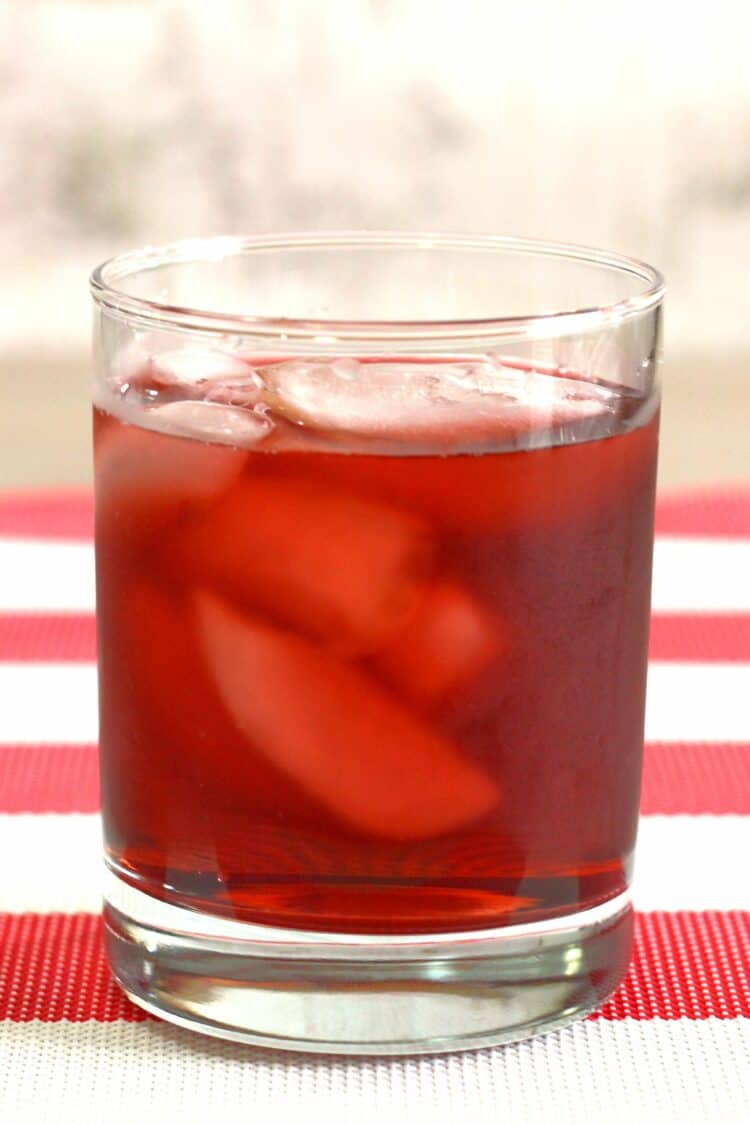 Spiced Watermelon Cooler drink on red and white tablecloth