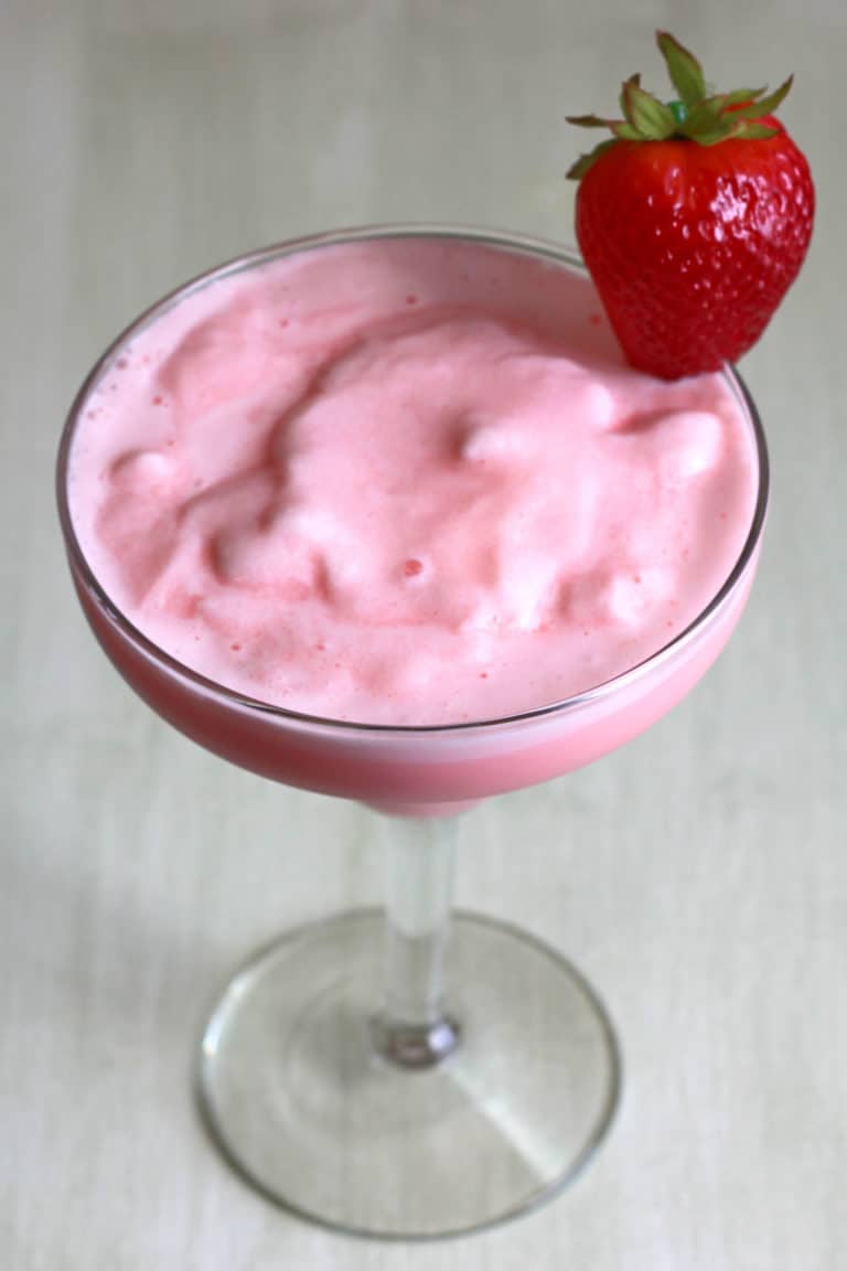 Overhead view of Strawberry-Banana Margarita with strawberry on rim