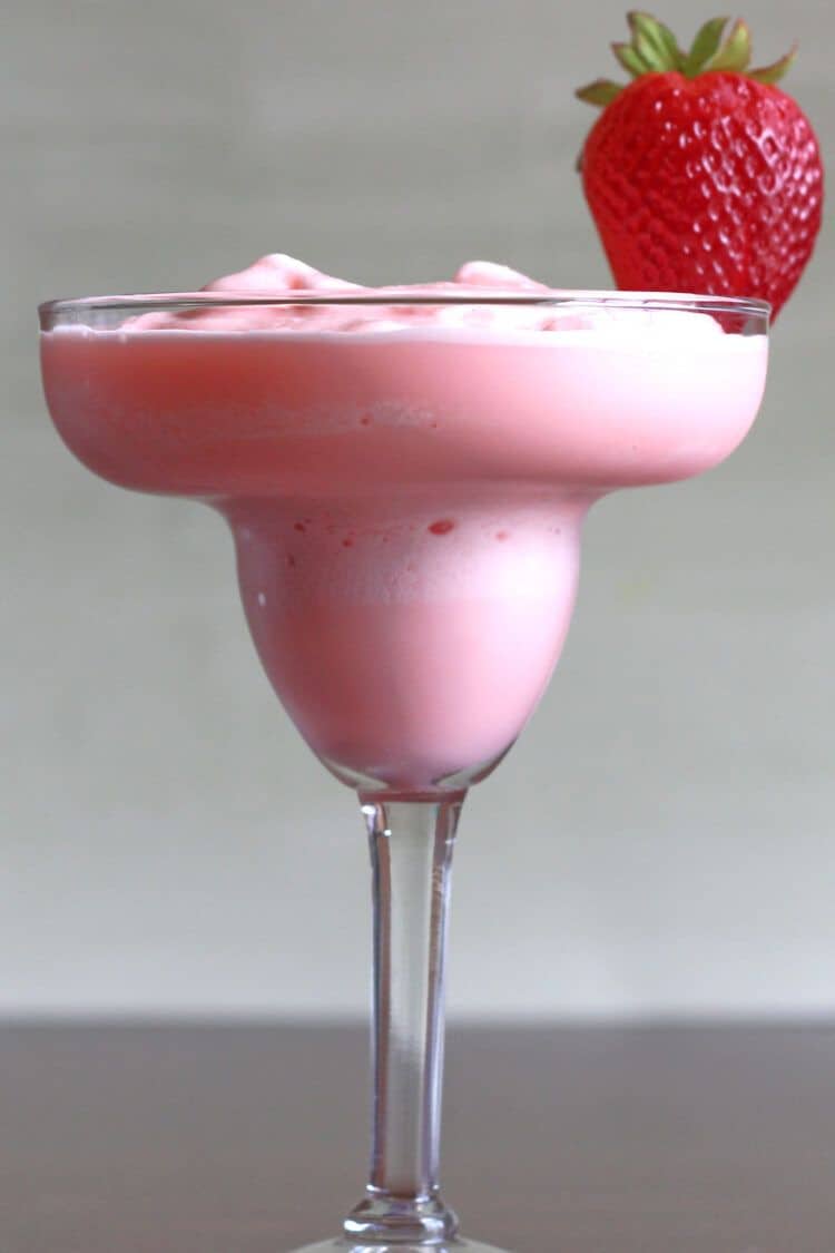 Strawberry-Banana Margarita with strawberry on rim