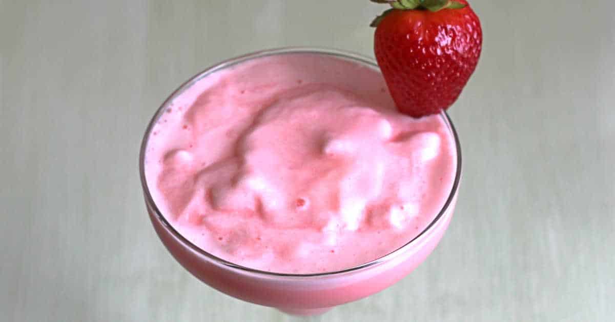 Strawberry-Banana Margarita with strawberry on rim