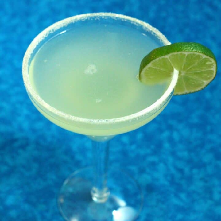 Top Shelf Margarita with lime wheel and salt rim