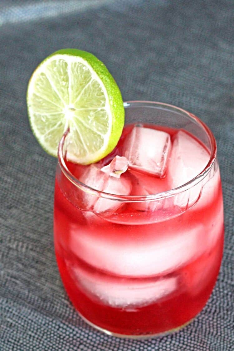 Vodka Cranberry drink on gray textured surface