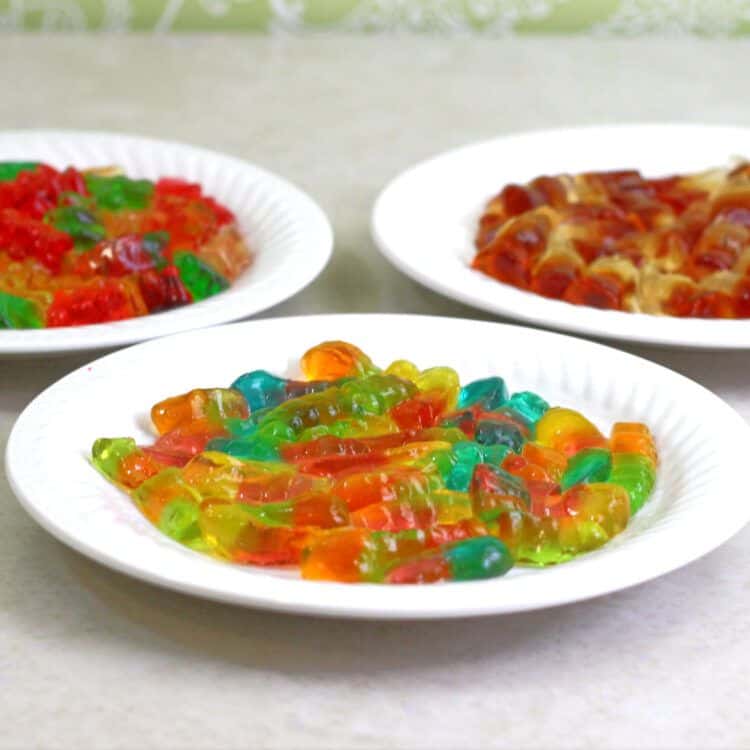 Vodka Gummy Bears, worms and colas on serving plates