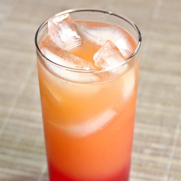 Vodka Sunrise drink in tall glass with ice