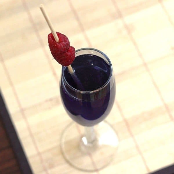 Overhead view of Volcano drink garnished with raspberries