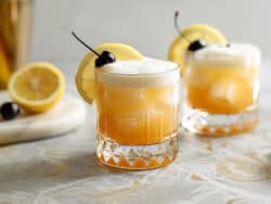 Whiskey Sour with cherry and lemon slice