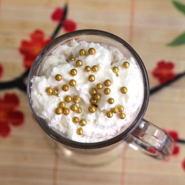 Overhead view of Xaviera cocktail with whipped cream and sugar pearls