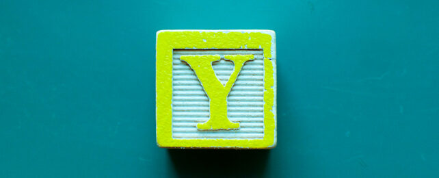 yellow children's block featuring letter Y